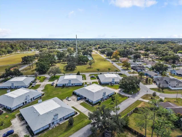 an aerial view of a house with a lake view