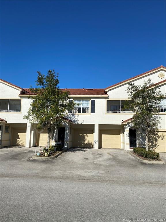 467 Southeast Kitching Circle Stuart, FL 34994 - Photo 1 of 11 a view of a building with a street