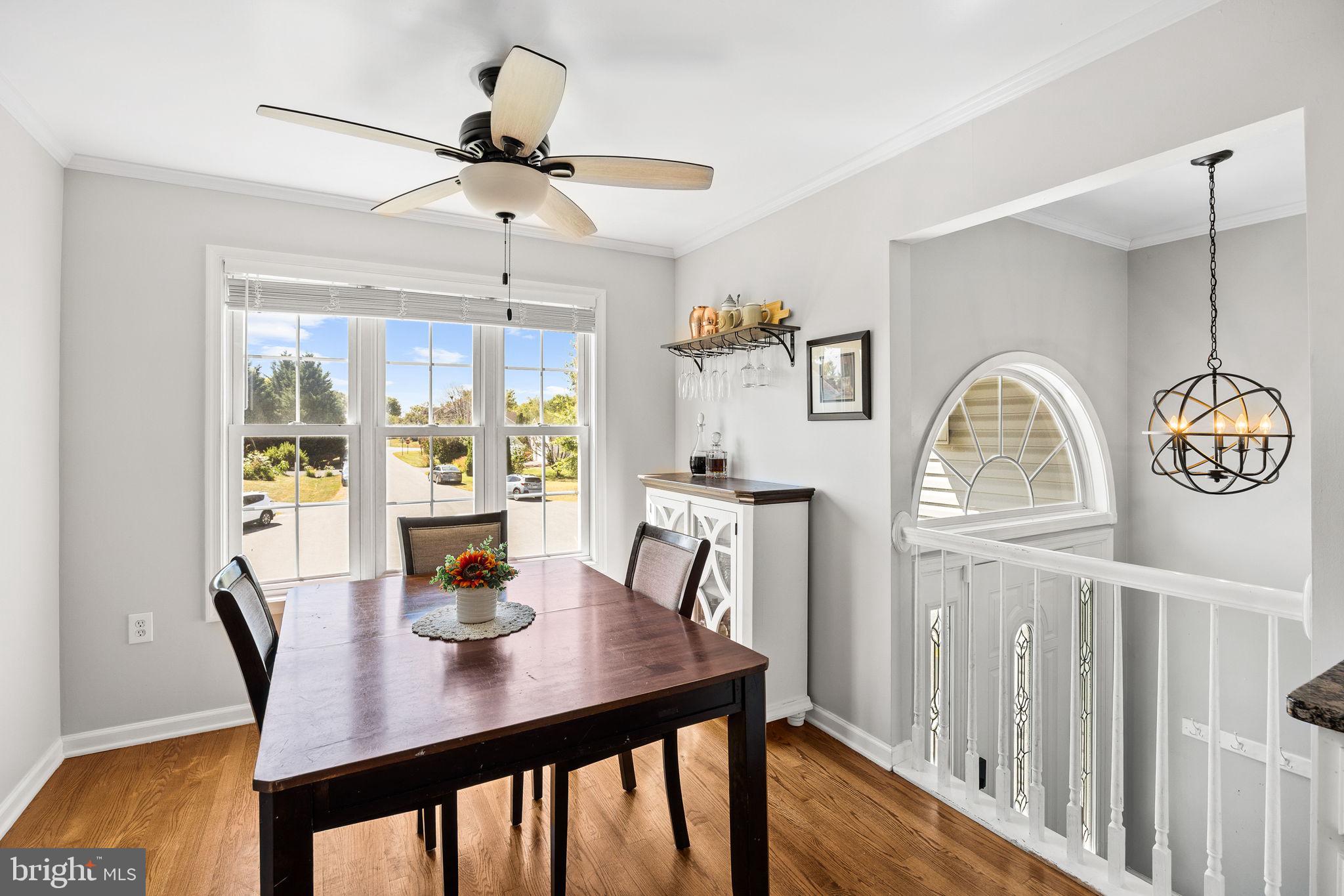 60 Trix Court Ranson, WV 25438 - Photo 11 of 47 a view of a dining room with furniture window and wooden floor