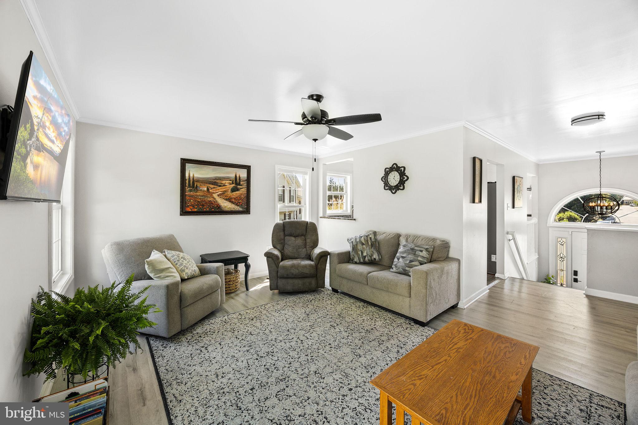 60 Trix Court Ranson, WV 25438 - Photo 18 of 47 a living room with furniture ceiling fan and a rug