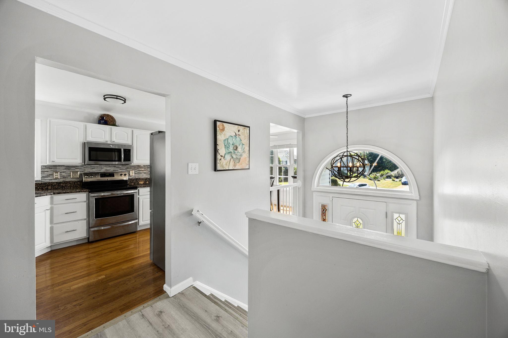 60 Trix Court Ranson, WV 25438 - Photo 20 of 47 a kitchen with stainless steel appliances a stove a sink and a refrigerator