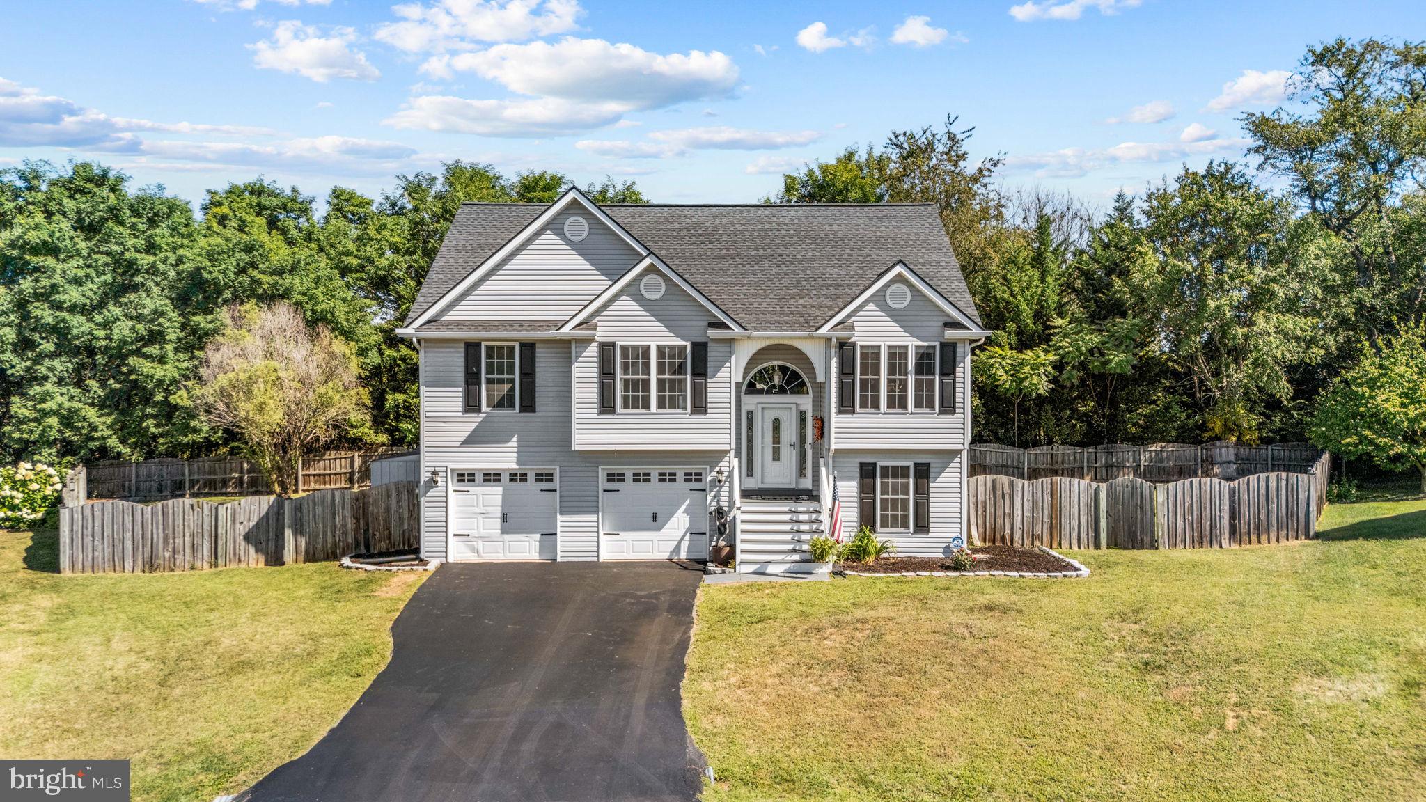 60 Trix Court Ranson, WV 25438 - Photo 2 of 47 a front view of a house with a yard