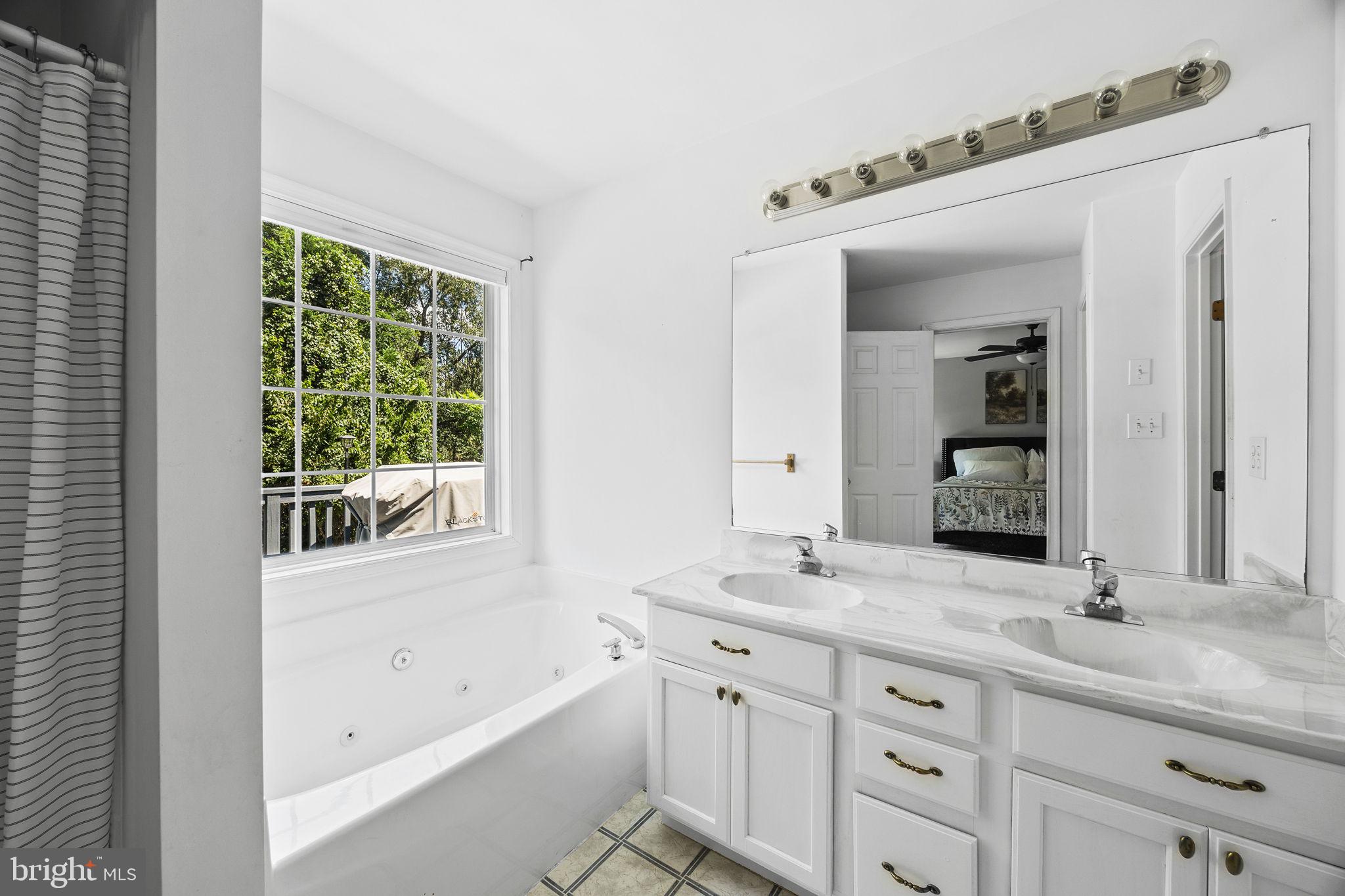 60 Trix Court Ranson, WV 25438 - Photo 27 of 47 a bathroom with a granite countertop sink mirror and double