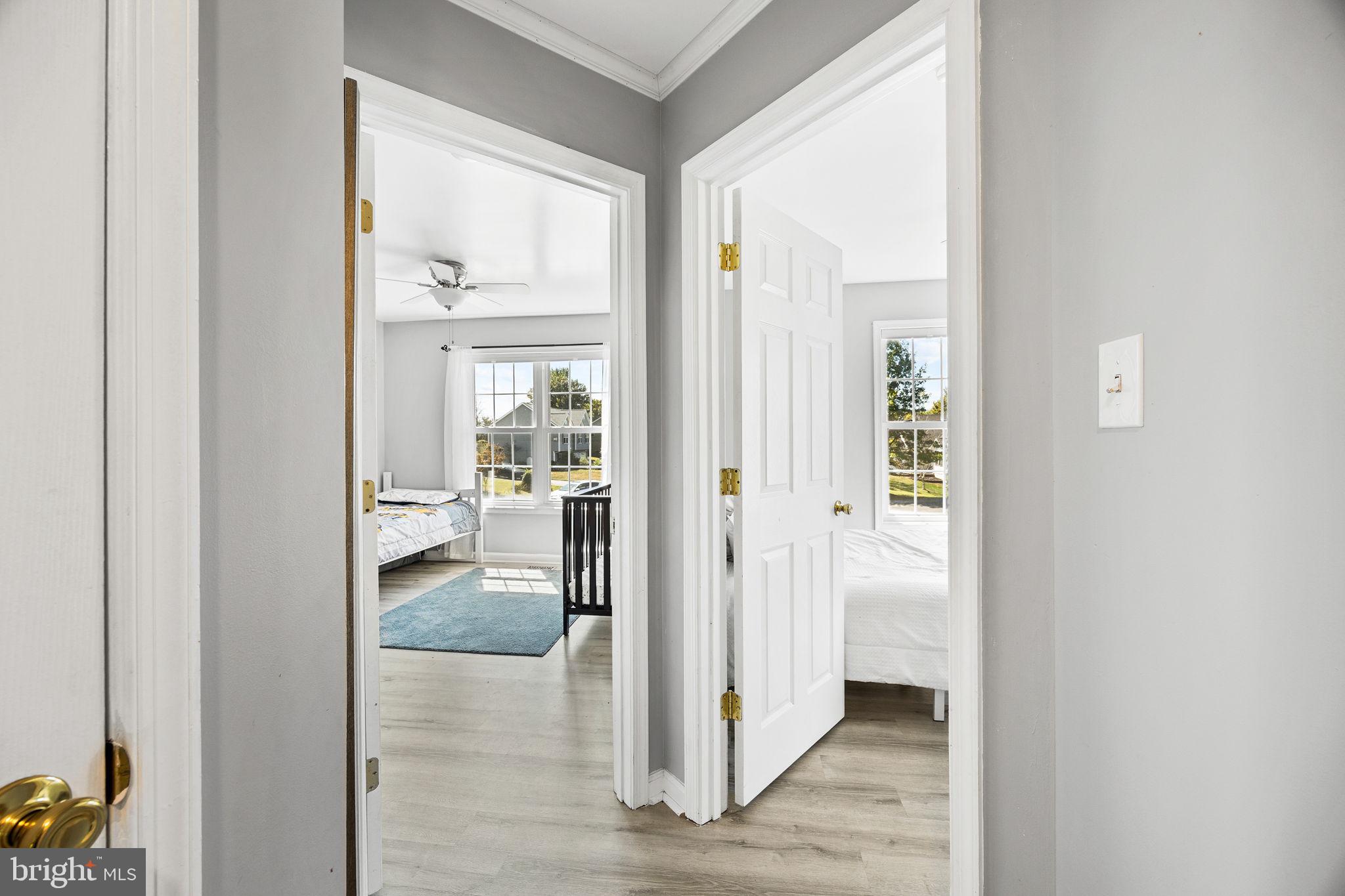 60 Trix Court Ranson, WV 25438 - Photo 32 of 47 a view of a hallway with wooden floor and a living room
