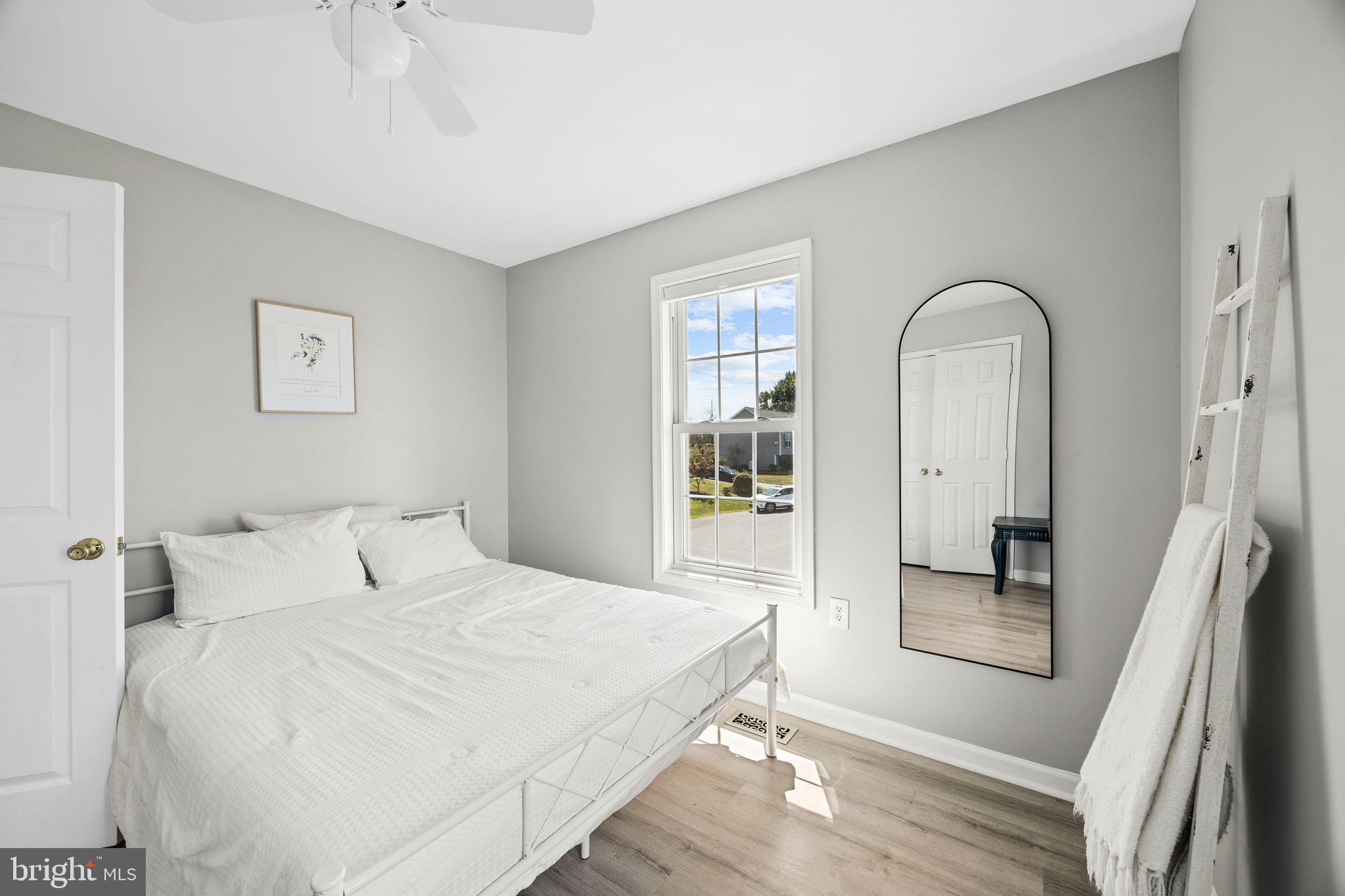 60 Trix Court Ranson, WV 25438 - Photo 34 of 47 a bedroom with a bed and a mirror