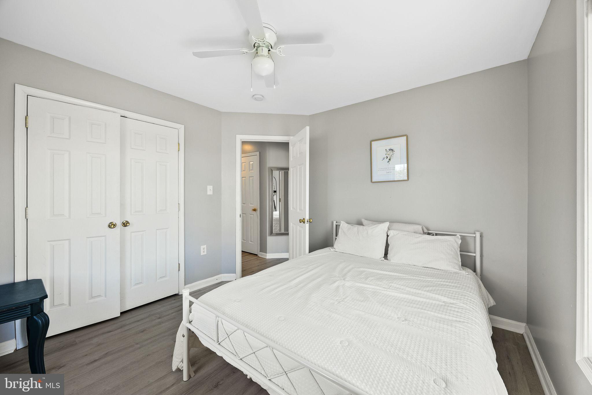 60 Trix Court Ranson, WV 25438 - Photo 35 of 47 a bedroom with a large bed and wooden floor