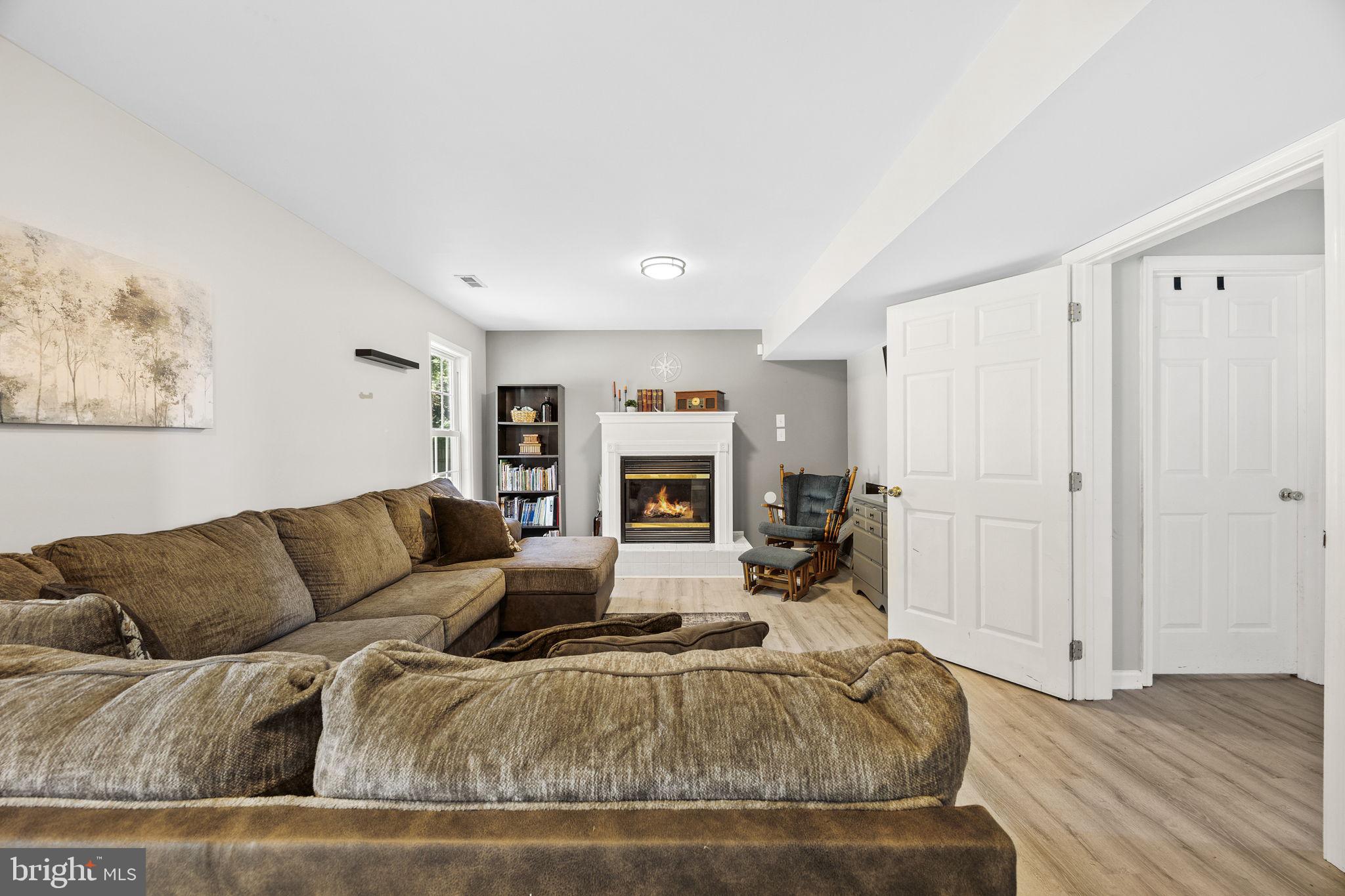60 Trix Court Ranson, WV 25438 - Photo 38 of 47 a living room with furniture and a fireplace