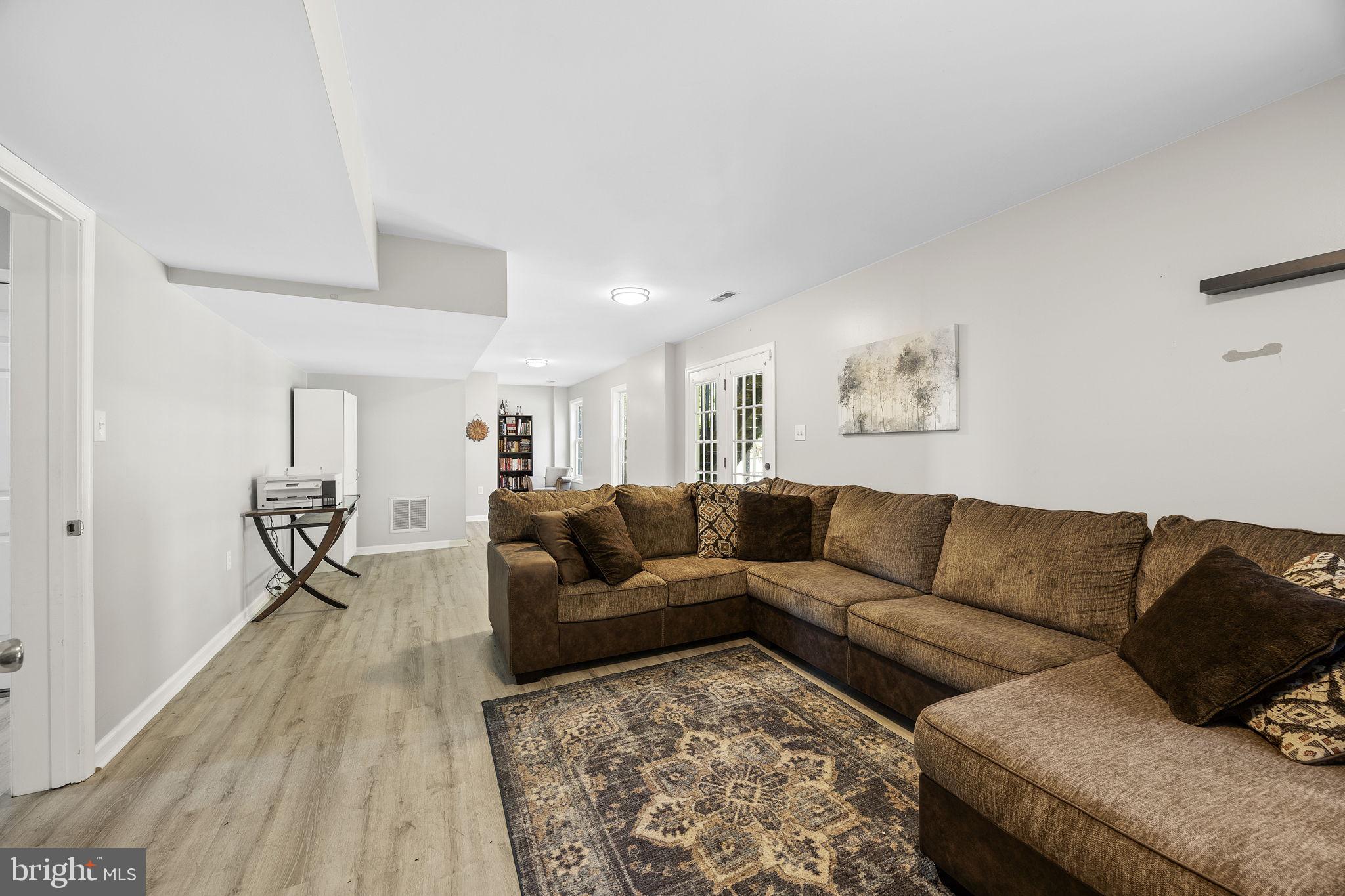 60 Trix Court Ranson, WV 25438 - Photo 41 of 47 a living room with furniture and a couch