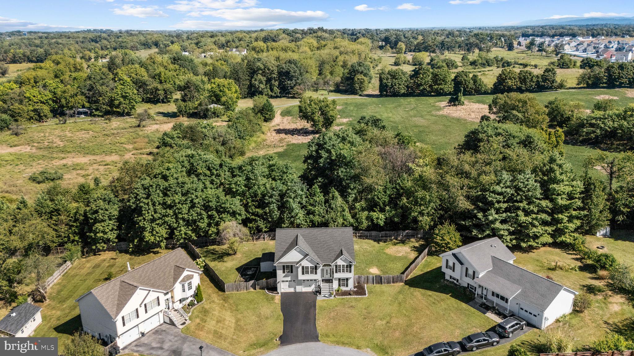 60 Trix Court Ranson, WV 25438 - Photo 7 of 47 an aerial view of a house with a yard