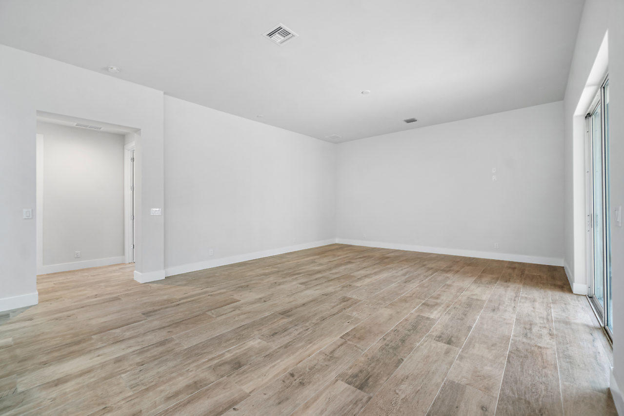 21311 Falls Ridge Way Boca Raton, FL 33428 - Photo 29 of 56 an empty room with wooden floor