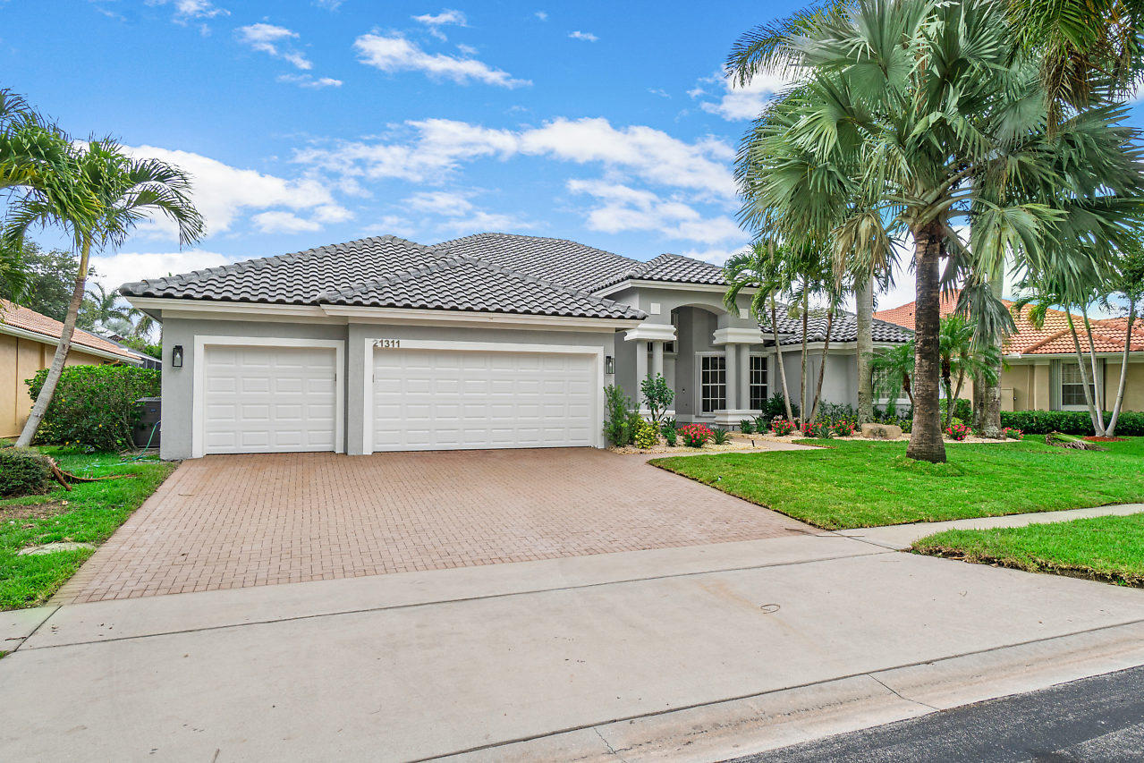 21311 Falls Ridge Way Boca Raton, FL 33428 - Photo 3 of 56 front view of a house with a yard
