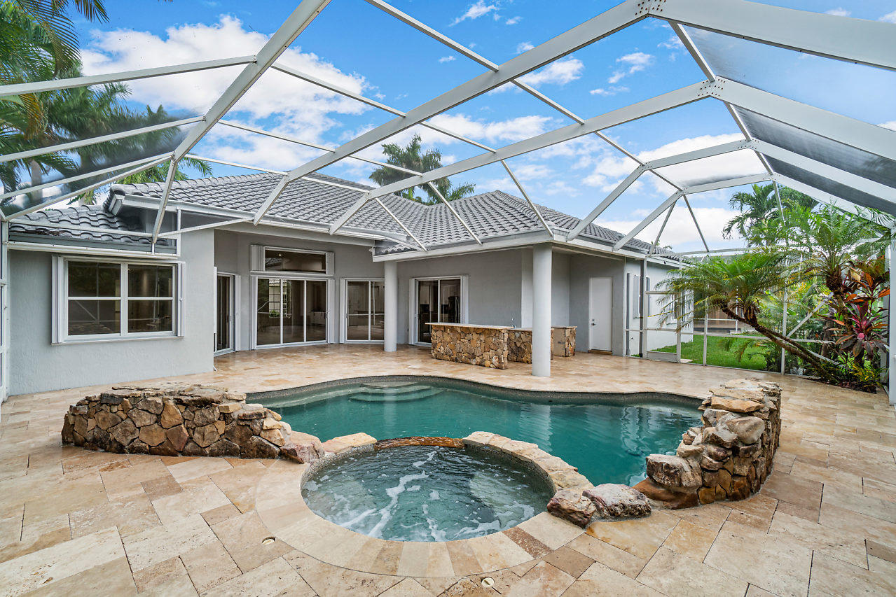 21311 Falls Ridge Way Boca Raton, FL 33428 - Photo 32 of 56 a house with swimming pool in front of it