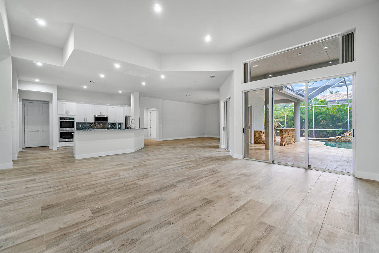 21311 Falls Ridge Way Boca Raton, FL 33428 - Photo 8 of 56 a view of large living room with wooden floor and a large window