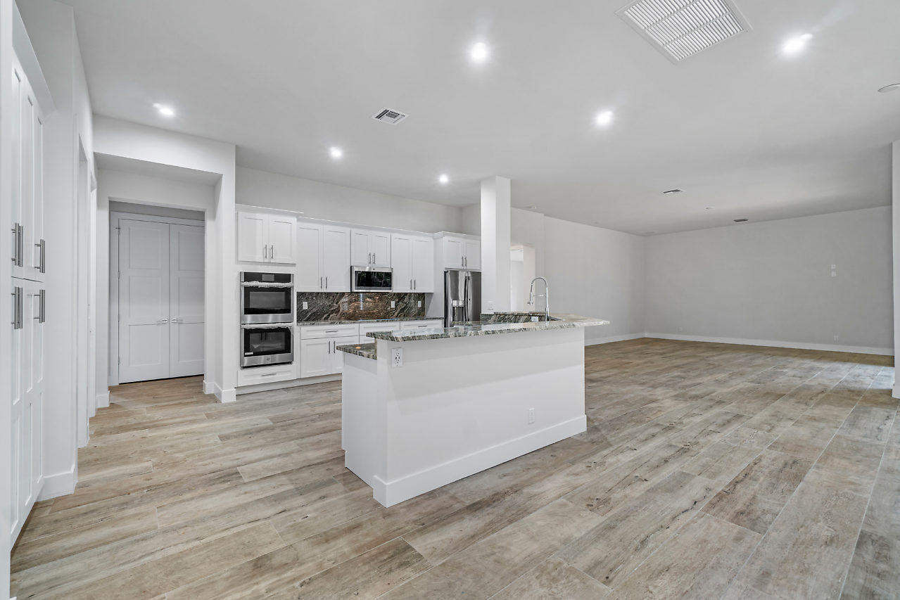 21311 Falls Ridge Way Boca Raton, FL 33428 - Photo 10 of 56 a view of kitchen with kitchen island stainless steel appliances refrigerator stove microwave and cabinets
