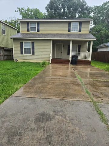 front view of a house with a yard