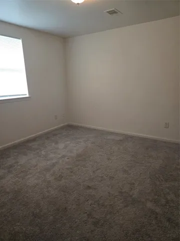 a bathroom with a toilet and a bathtub