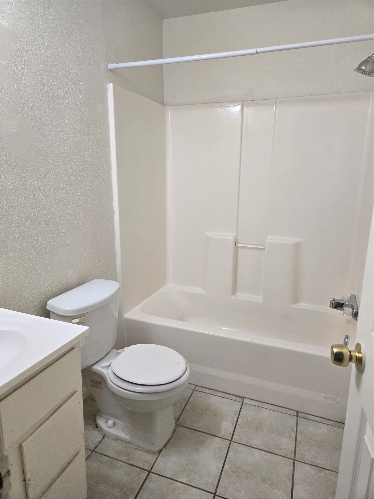 4215 Ross Avenue Bacliff, TX 77518 - Photo 13 of 14 a bathroom with a toilet and a bathtub