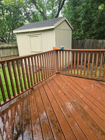 a balcony with wooden floor