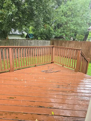 a balcony with trees in the background