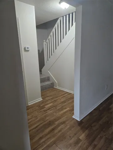 a view of entryway with wooden floor