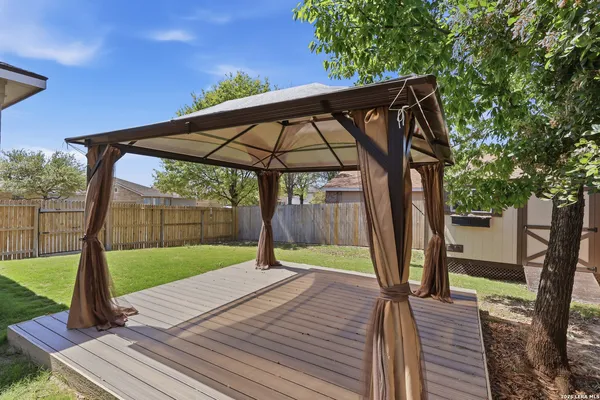 a view of a backyard with a small cabin