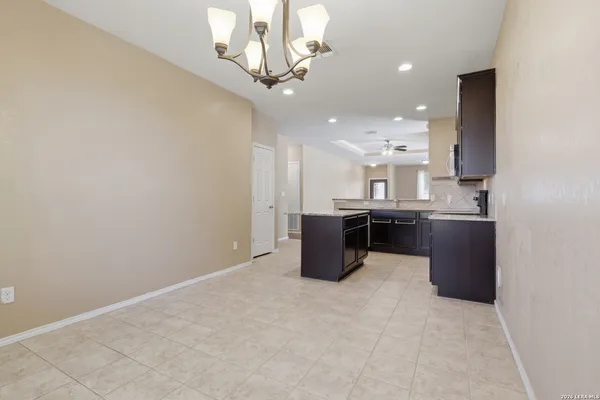 a view of a kitchen with a sink stainless steel appliances and cabinets