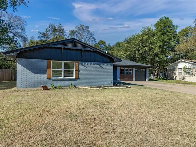 a house with trees in the background