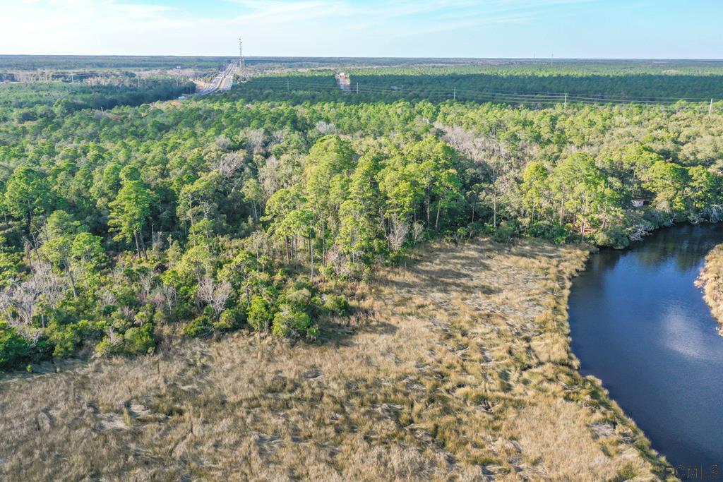 605 Faver Dykes Road St. Augustine, FL 32086 - Photo 2 of 12 a view of a lake with a mountain view