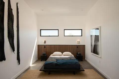 an entrance to house with yard and parking