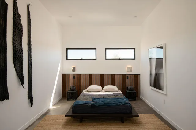 an entrance to house with yard and parking