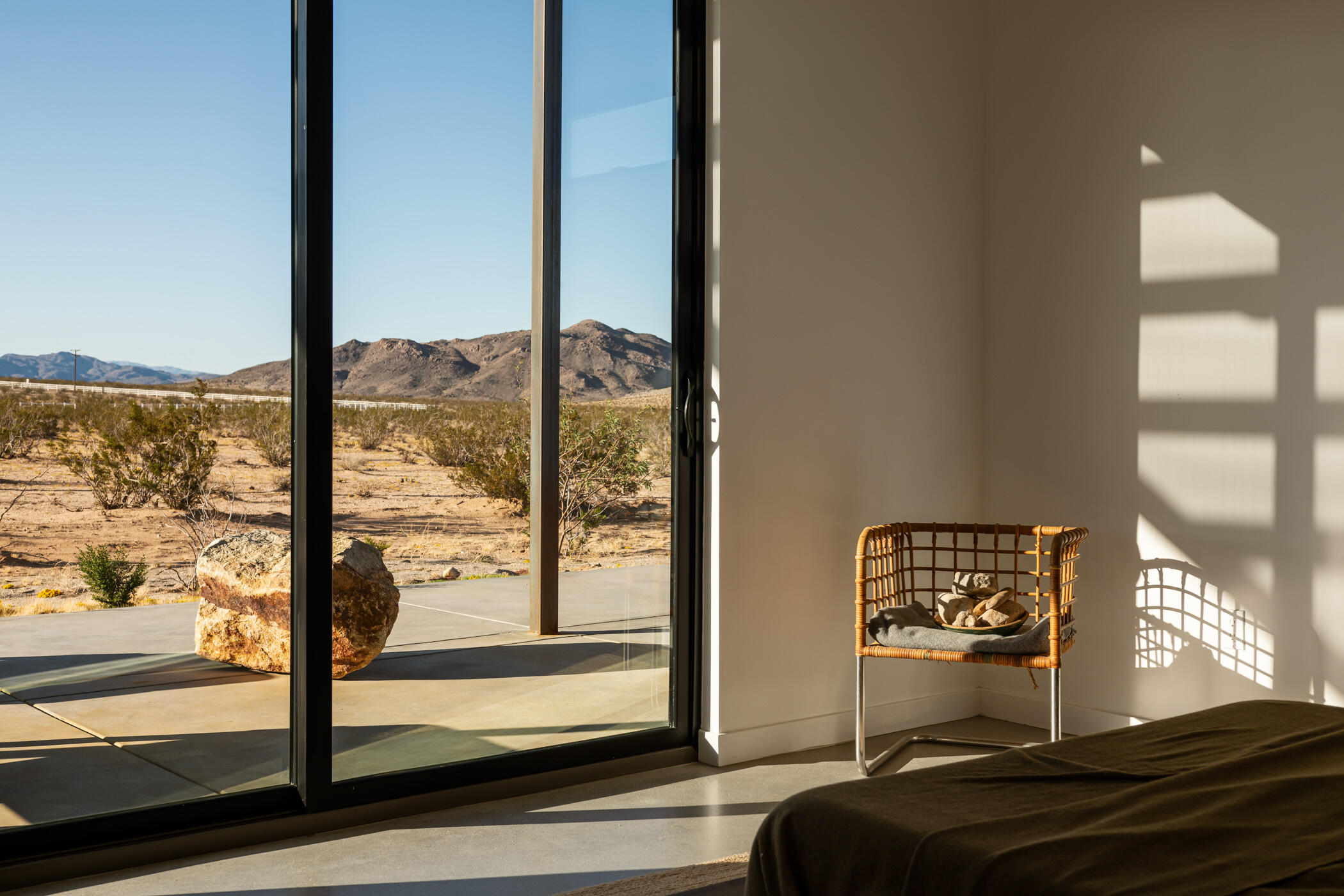 60052 Rocky Road Landers, CA 92285 - Photo 27 of 42 a bedroom with a bed and glass door
