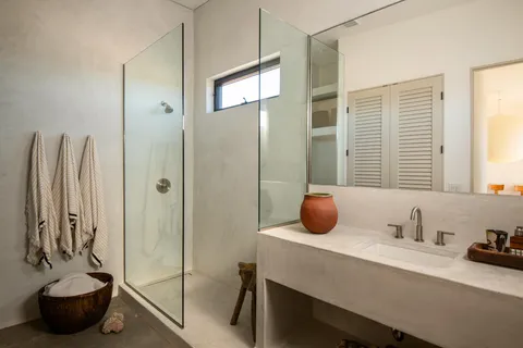 a bedroom with a bed and cabinets