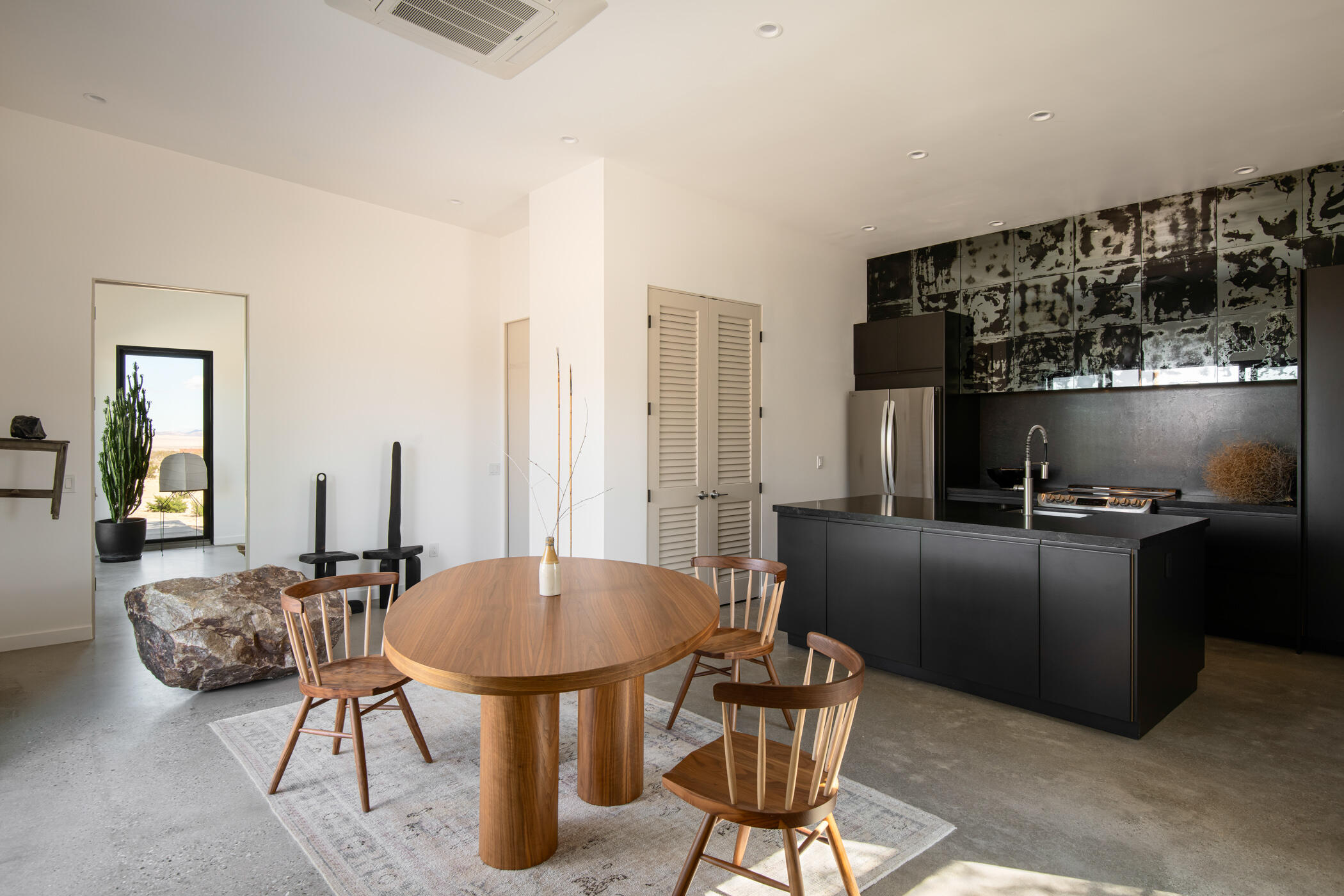 60052 Rocky Road Landers, CA 92285 - Photo 5 of 42 a kitchen with stainless steel appliances kitchen island granite countertop furniture and a refrigerator