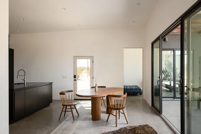 a kitchen with a refrigerator and a stove