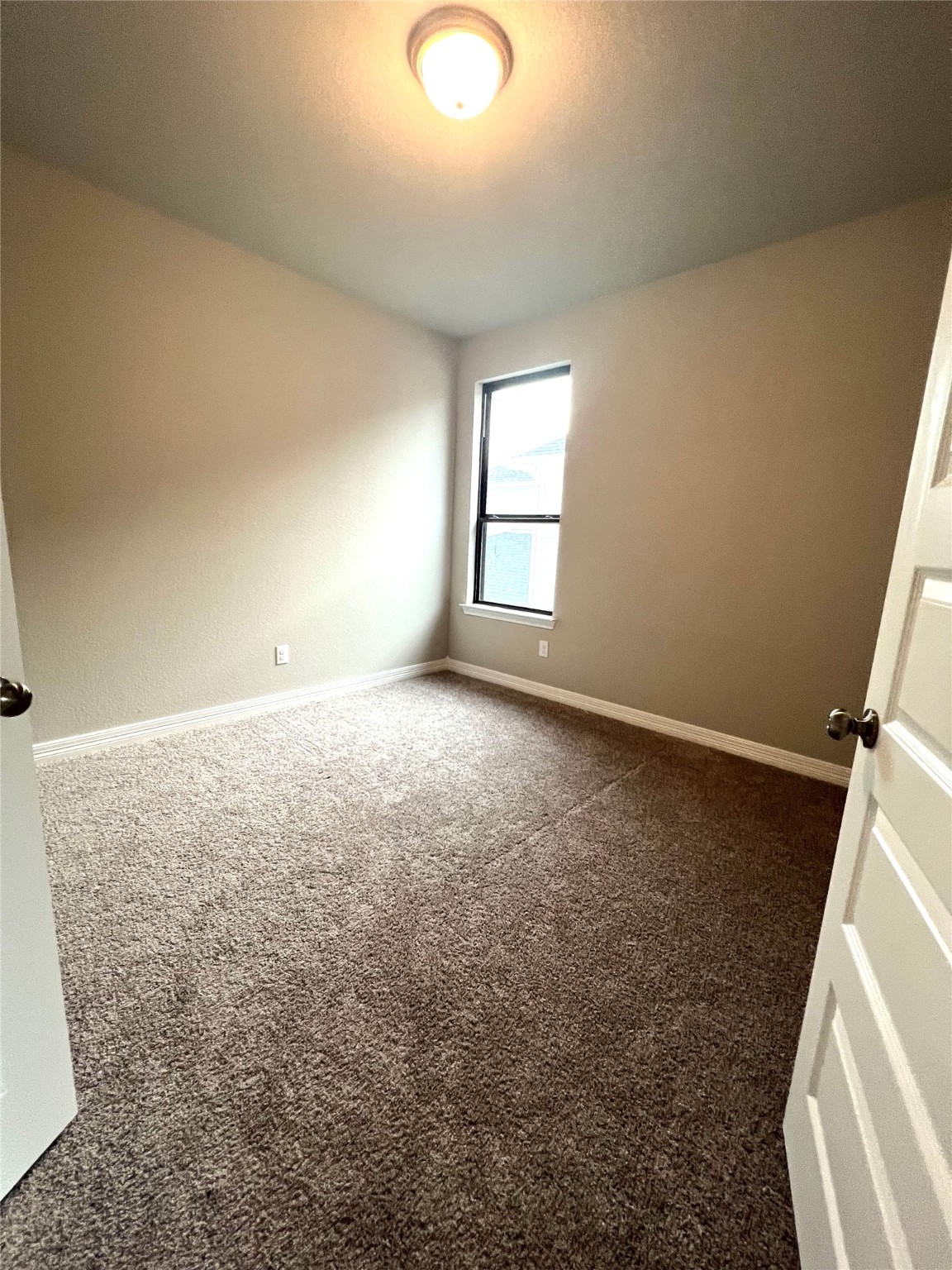 24239 Maple Summit Lane Katy, TX 77494 - Photo 15 of 17 an empty room with windows