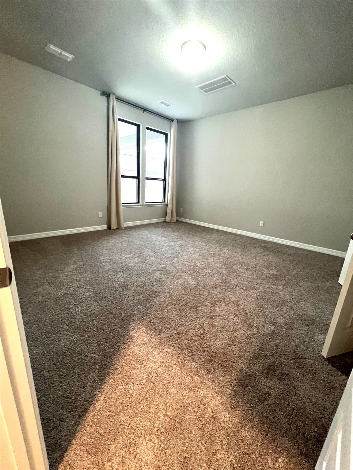 24239 Maple Summit Lane Katy, TX 77494 - Photo 3 of 17 an empty room with windows