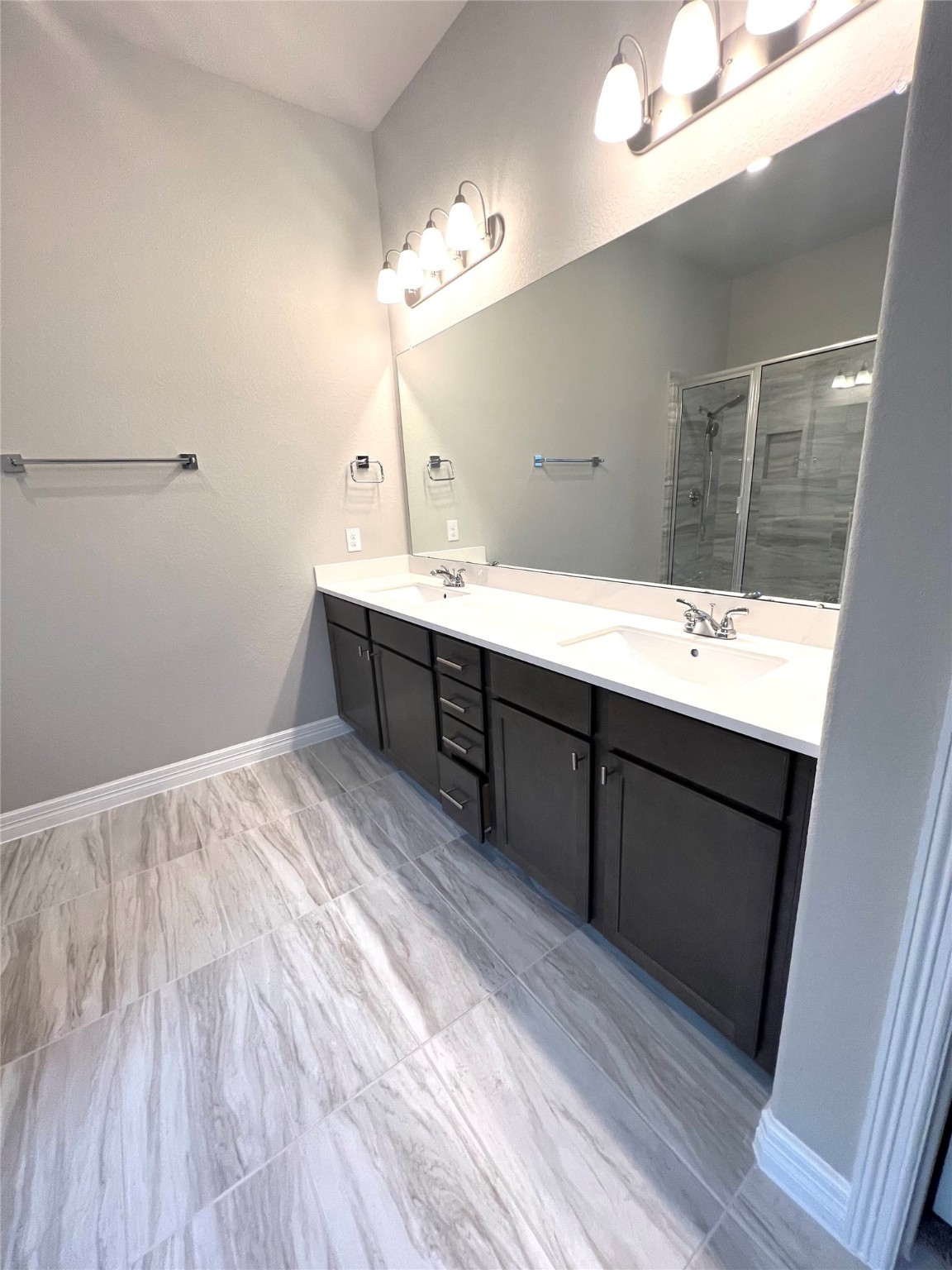 24239 Maple Summit Lane Katy, TX 77494 - Photo 6 of 17 a bathroom with a sink vanity granite and a mirror