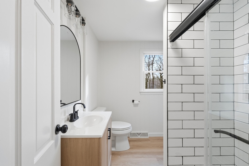 18 Emery Road Townsend, MA 01469 - Photo 8 of 18 a bathroom with a sink toilet and mirror