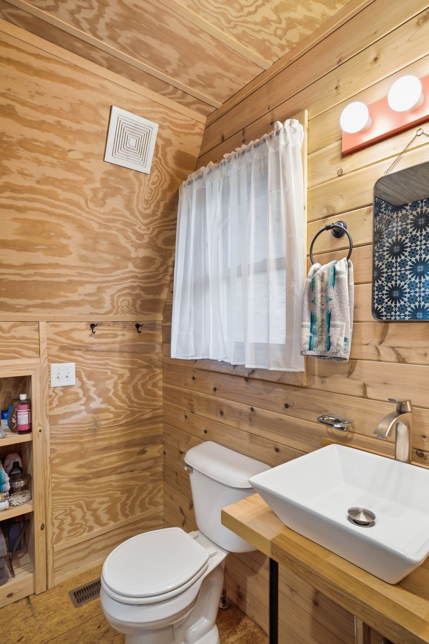 1277 Loftis Road Ashland City, TN 37015 - Photo 16 of 25 a bathroom with a sink a toilet and shower curtain