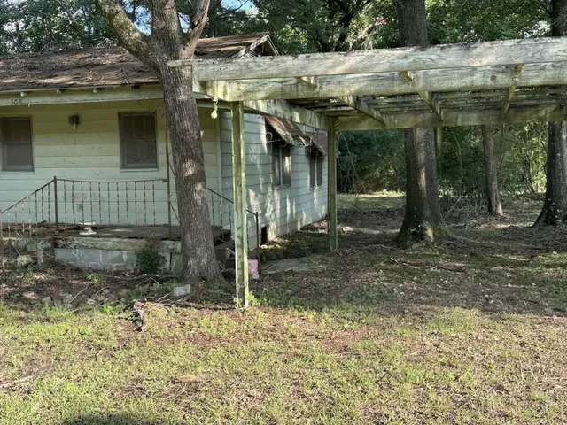 a backyard of a house with lots of green space