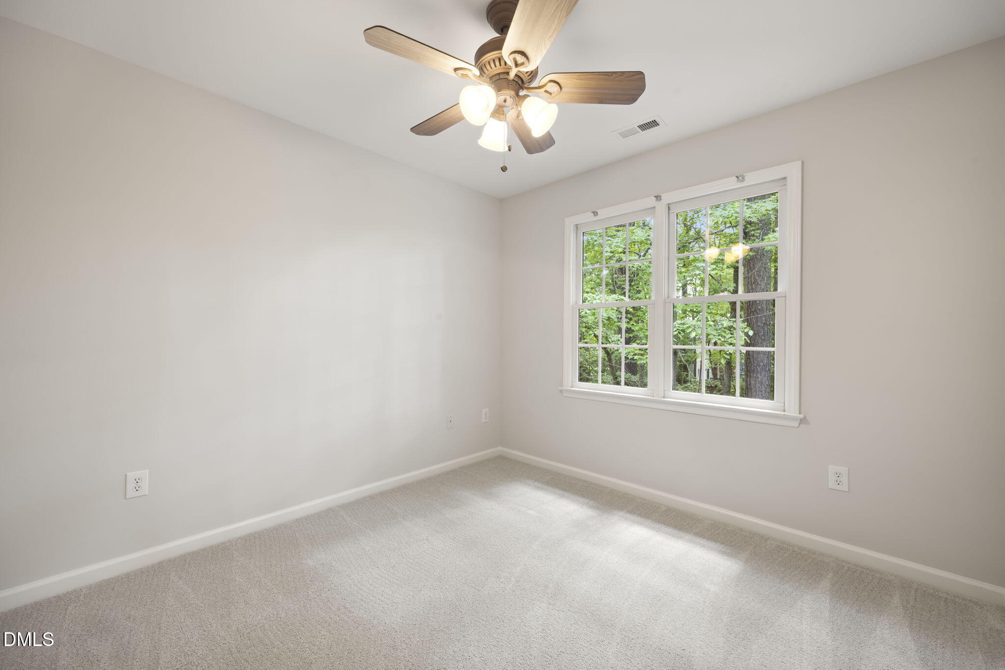 1008 Scotts Ridge Trail Apex, NC 27502 - Photo 29 of 57 an empty room with windows and fan