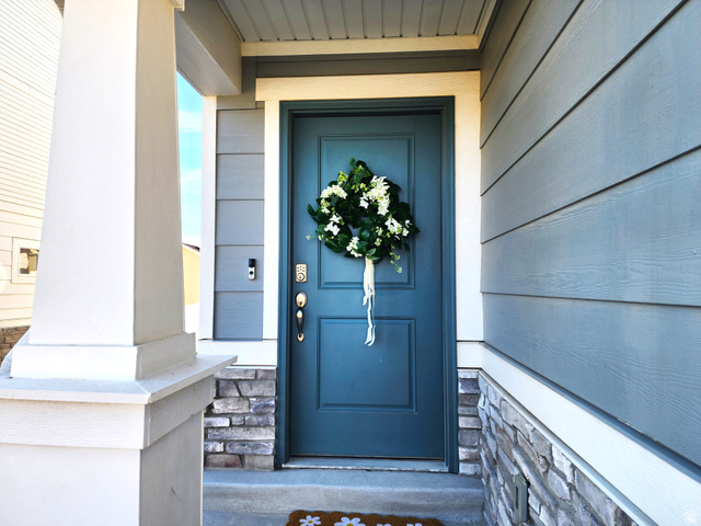 1736 East Fall Street Eagle Mountain, UT 84005 - Photo 4 of 30 Entrance to property featuring stone siding and a porch