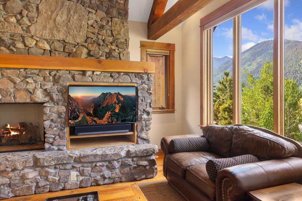 210 South Sunset Ridge Drive Telluride, CO 81435 - Photo 6 of 18 a living room with furniture and a fireplace