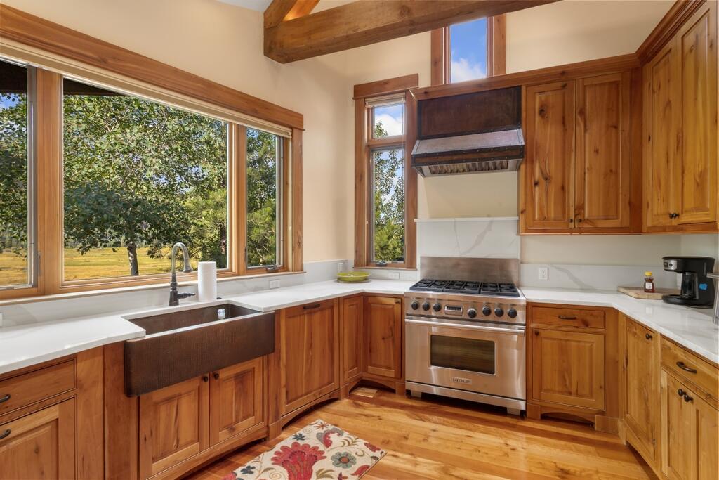 210 South Sunset Ridge Drive Telluride, CO 81435 - Photo 10 of 18 a kitchen with a sink stove and cabinets