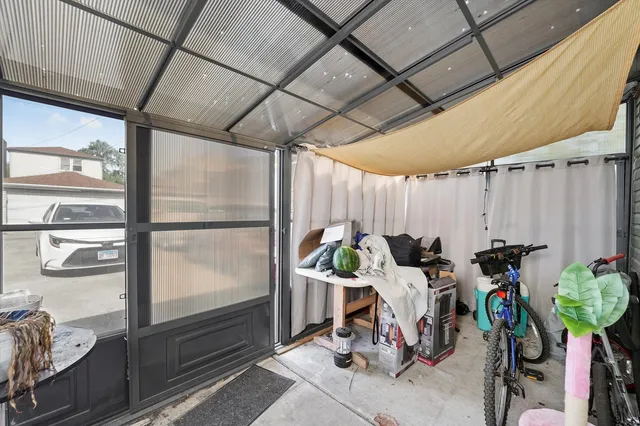 a view of a bike storage and utility room