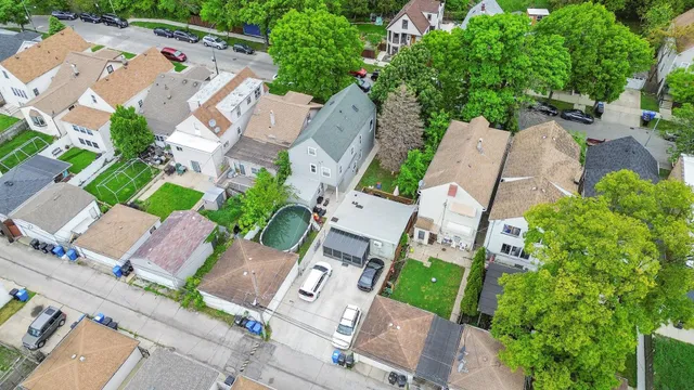 an aerial view of residential house with outdoor space and street view