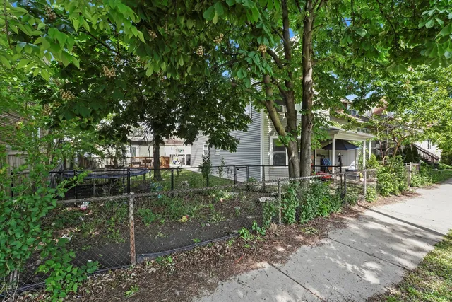 a backyard of a house with lots of green space