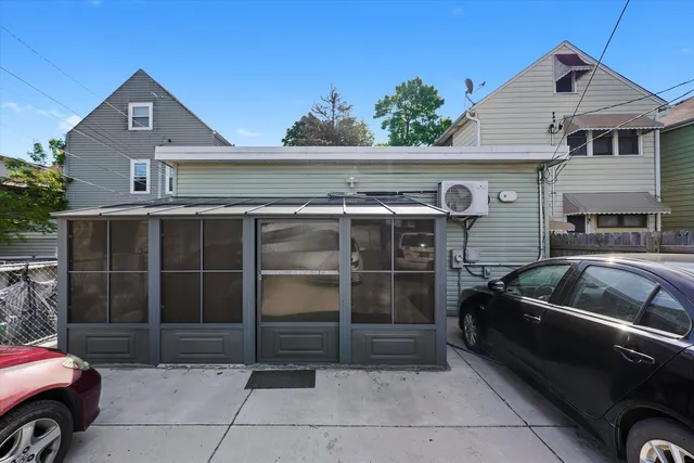a view of a car parked in front of a house