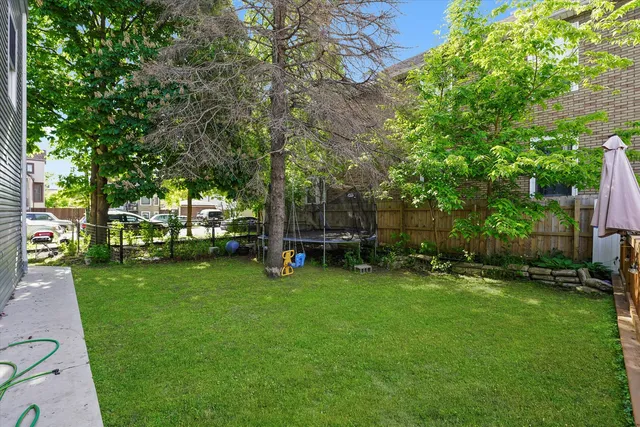a view of a backyard with sitting area