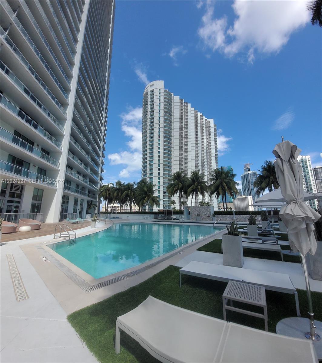 90 Southwest 3rd Street, Unit 2208 Miami, FL 33130 - Photo 33 of 56 a view of a swimming pool with outdoor seating
